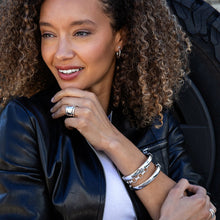 Load image into Gallery viewer, woman wearing  two stacked hammered metal silver rings
