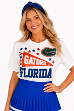 Load image into Gallery viewer, woman in white t-shirt with a Florida Gators Pennant, stars and the gator head logo 
