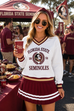 Load image into Gallery viewer, Person wearing a Florida State Heritage V-Neck Pullover at a game day party
