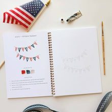 Load image into Gallery viewer, open workbook showing page with stars and stripes banner
