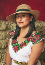 Load image into Gallery viewer, woman in a colorful dress wearing the Chloe Hand-woven Palm Hat
