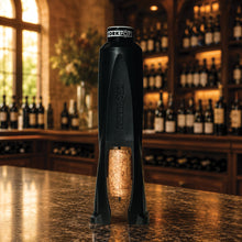 Load image into Gallery viewer, Legacy Cork Pops holding a cork on a bar top
