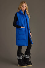 Load image into Gallery viewer, woman in long sleeeless Royal Blue Vest with her hand in the side pocket

