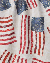 Load image into Gallery viewer, close up of the American flag made from floral red and blue print on the tea towel 
