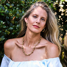 Load image into Gallery viewer, person wearing gold jewelry 
