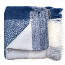 Load image into Gallery viewer, Crestland Throw - Navy/White folded showing a variety of shades of blue
