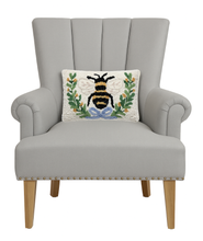 Load image into Gallery viewer, Bee In A Wreath Hook Pillow on a chair
