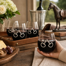 Load image into Gallery viewer, person holding a Equestrian Bit Stemless Wine Glasses with three more glasses on a tray
