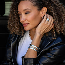 Load image into Gallery viewer, woman wearing a Berry Slice Small Hoop Earrings in silver and other silver jewelry
