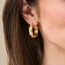 Load image into Gallery viewer, perso wearing Capucine de Wulf Huggie Hoop Earrings
