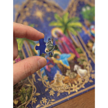 Load image into Gallery viewer, person holding a puzzle piece of the Advent Puzzle Starlit Nativity
