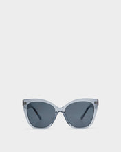 Load image into Gallery viewer, Katie Loxton Mykonos Oversized Cat-Eye Sunglasses in transparent blue frames and black lenses
