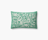 blue green pillow with white embroidery with text Read