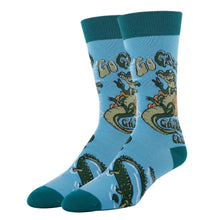 Load image into Gallery viewer, Blue and green socks with images of alligators
