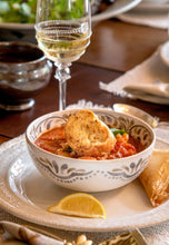 Load image into Gallery viewer, Fish chowder served in Iberian Bowl on Le Panier Dinner Plate
