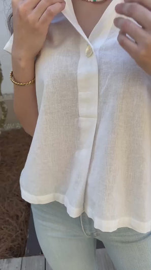 close up of neckline and single button