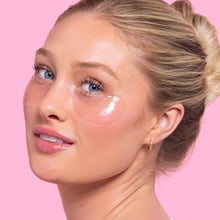 Load image into Gallery viewer, person wearing the Serve Chilled Rose Hydrating Eye Gels 
