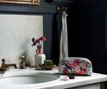 Load image into Gallery viewer, Garden Party Small Cosmetic Pouch sitting on bathroom counter 
