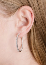 Load image into Gallery viewer, person wearing small Crislu Pave Hoop Earrings Finished in Pure Platinum
