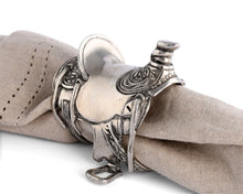 Load image into Gallery viewer, Pewter Cowboy Saddle Napkin Ring on a tan napkin
