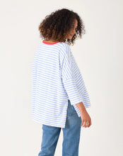 Load image into Gallery viewer, person wearing Mersea Catalina Slub Stripe Ringer Tee white and light blue paired with blue jeans side view
