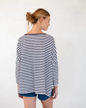 Load image into Gallery viewer, person wearing Mersea Catalina Slub Stripe Ringer Tee white and navy paired with blue shorts back view
