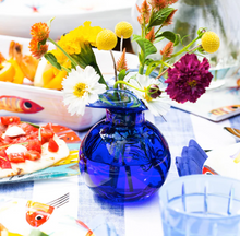Load image into Gallery viewer, Vietri Hibiscus Glass Cobalt Bud Vase with flowers on a summer table
